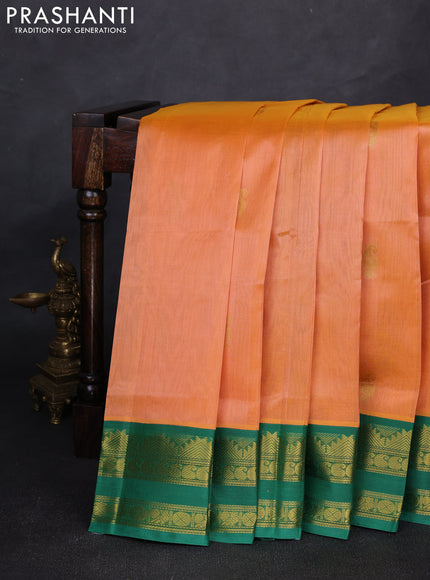 Silk cotton saree pale orange and green with allover paisley zari woven buttas and temple design rettapet zari woven korvai border