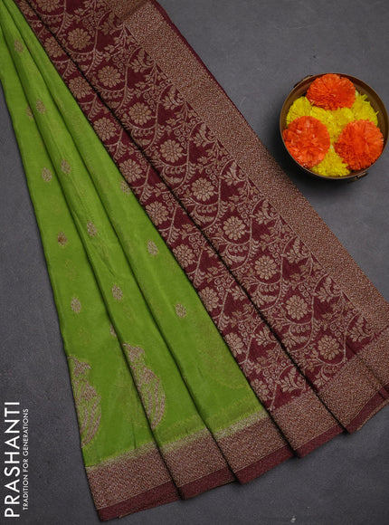 Banarasi semi crepe saree light green and deep maroon with allover thread & zari woven buttas and woven border