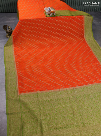Banarasi semi crepe saree orange and light green with allover thread & zari woven buttas and woven border