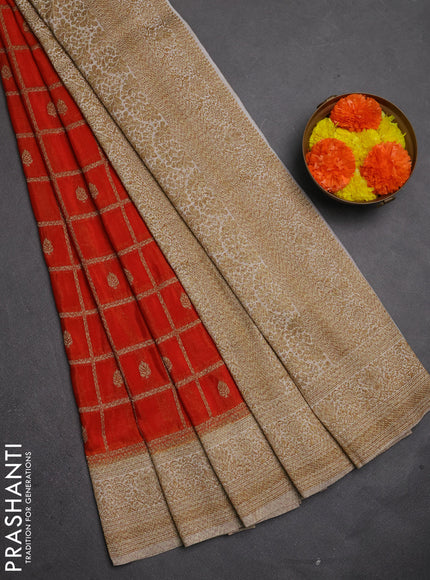 Banarasi semi crepe saree orange and off white with allover woven checks & buttas and woven border