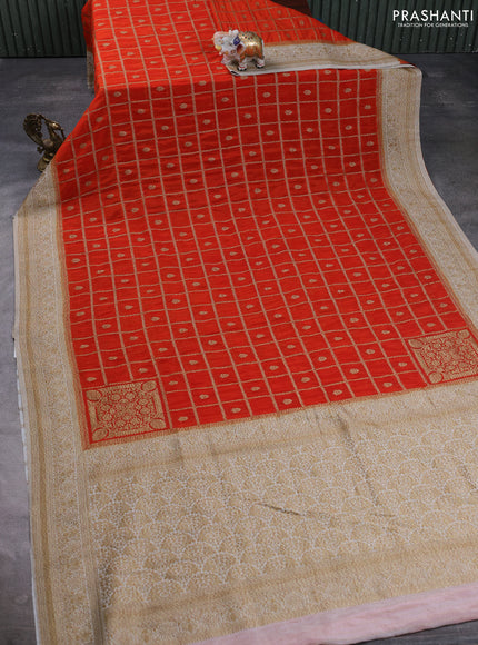 Banarasi semi crepe saree orange and off white with allover woven checks & buttas and woven border