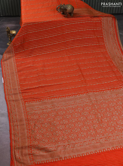Banarasi semi crepe saree orange with allover thread & zari weaves and woven border