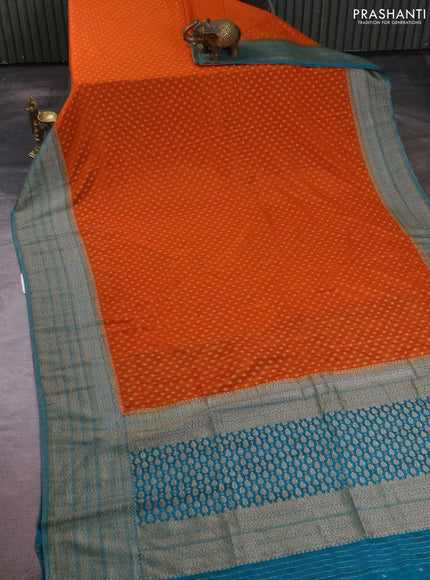 Banarasi semi crepe saree orange and teal green with allover thread & zari woven buttas and long woven border