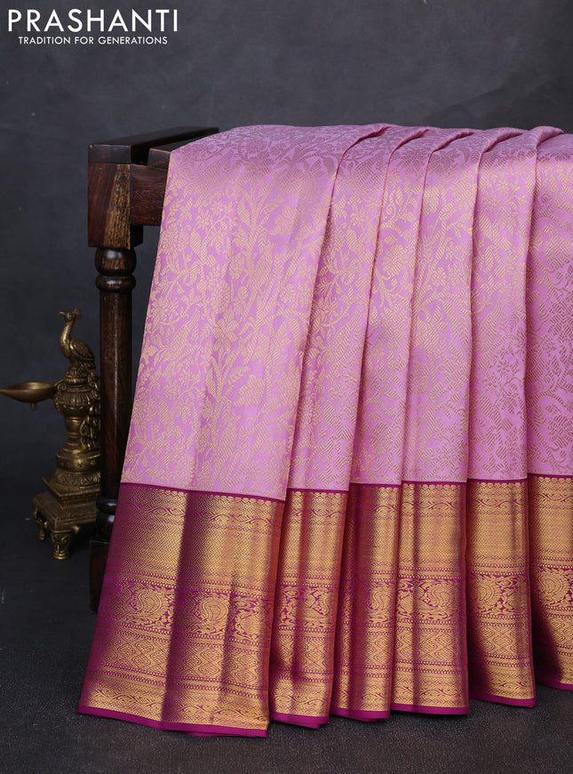 Pure kanchipuram silk saree mild lavender and purple with allover zari woven brocade weaves and long rich zari woven border