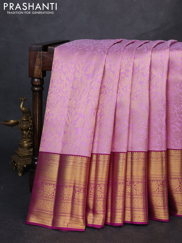 Pure kanchipuram silk saree mild lavender and purple with allover zari woven brocade weaves and long rich zari woven border