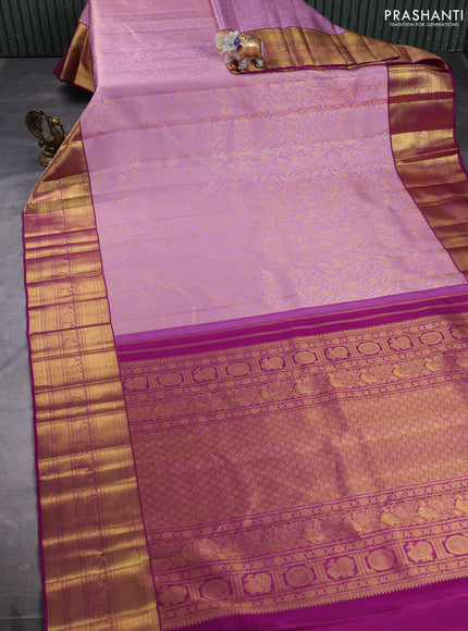 Pure kanchipuram silk saree mild lavender and purple with allover zari woven brocade weaves and long rich zari woven border