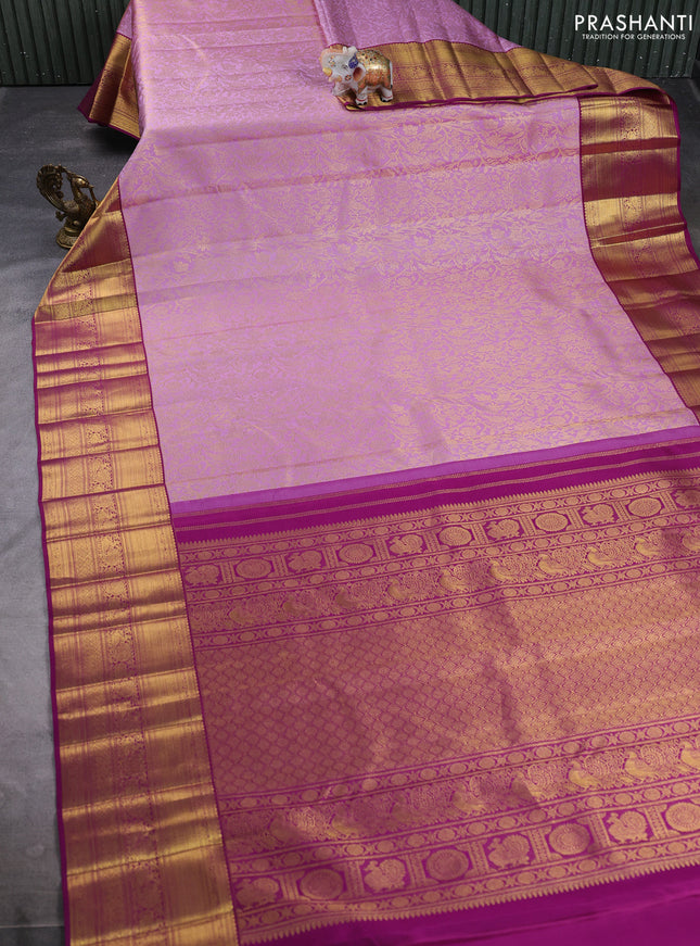 Pure kanchipuram silk saree mild lavender and purple with allover zari woven brocade weaves and long rich zari woven border