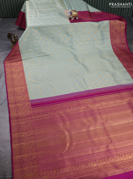 Pure kanchipuram silk saree pastel blue and purple with allover zari woven brocade weaves and long rich zari woven annam border
