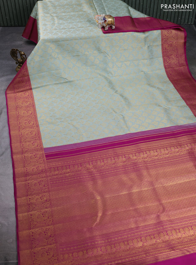 Pure kanchipuram silk saree pastel blue and purple with allover zari woven brocade weaves and long rich zari woven annam border