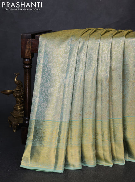 Pure kanchipuram tissue silk saree golden pastel green with allover zari woven brocade weaves and long rich zari woven border