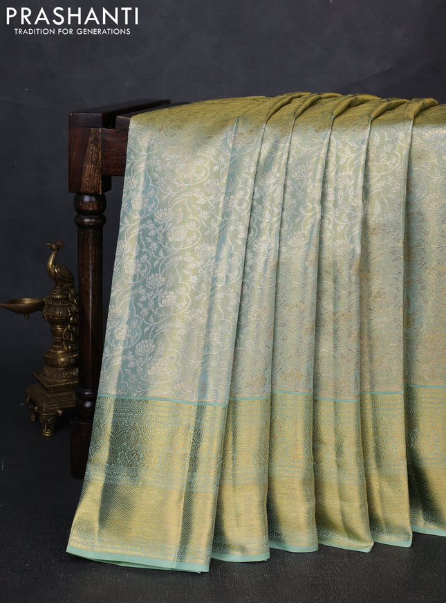 Pure kanchipuram tissue silk saree golden pastel green with allover zari woven brocade weaves and long rich zari woven border