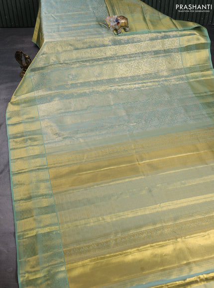 Pure kanchipuram tissue silk saree golden pastel green with allover zari woven brocade weaves and long rich zari woven border