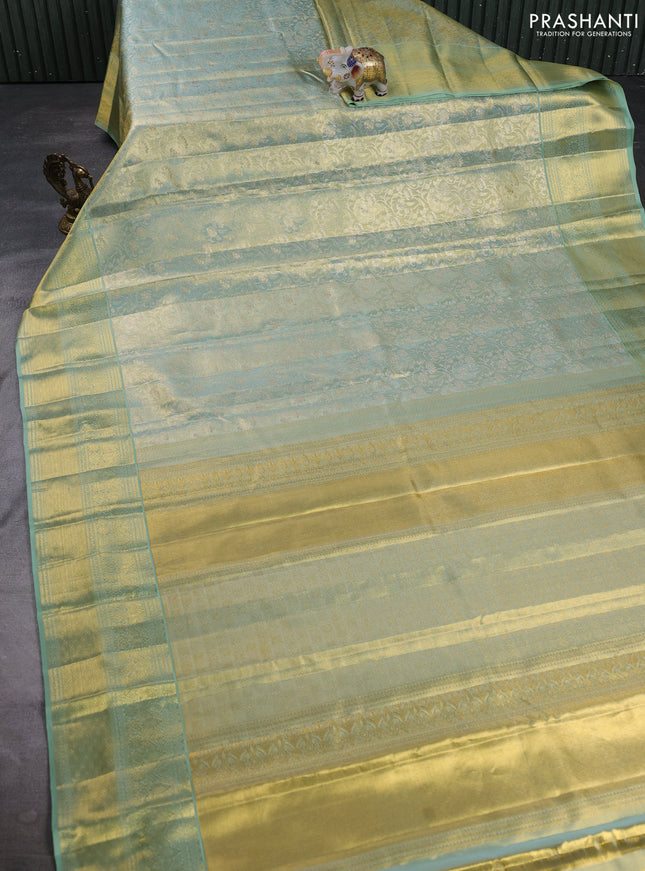 Pure kanchipuram tissue silk saree golden pastel green with allover zari woven brocade weaves and long rich zari woven border