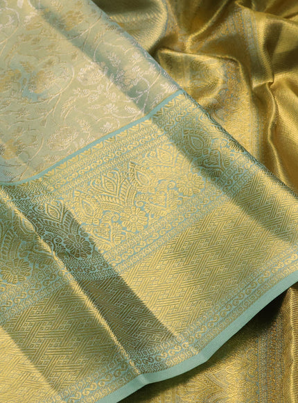 Pure kanchipuram tissue silk saree golden pastel green with allover zari woven brocade weaves and long rich zari woven border