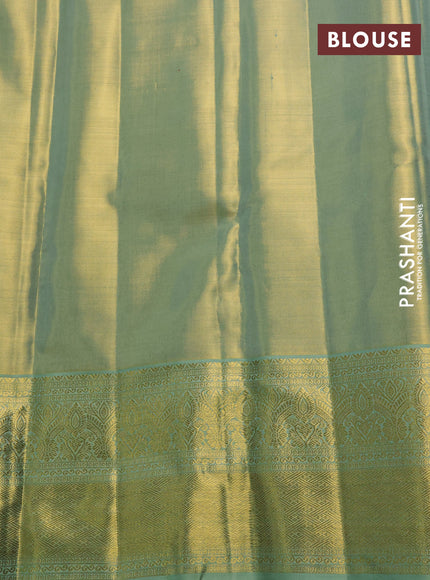 Pure kanchipuram tissue silk saree golden pastel green with allover zari woven brocade weaves and long rich zari woven border