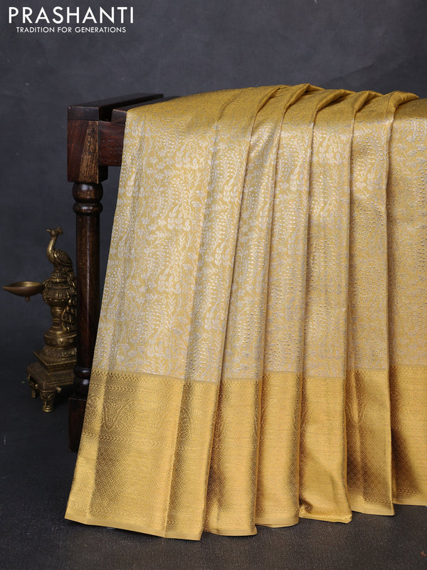 Pure kanchipuram tissue silk saree gold with allover zari woven brocade weaves and long rich zari woven border