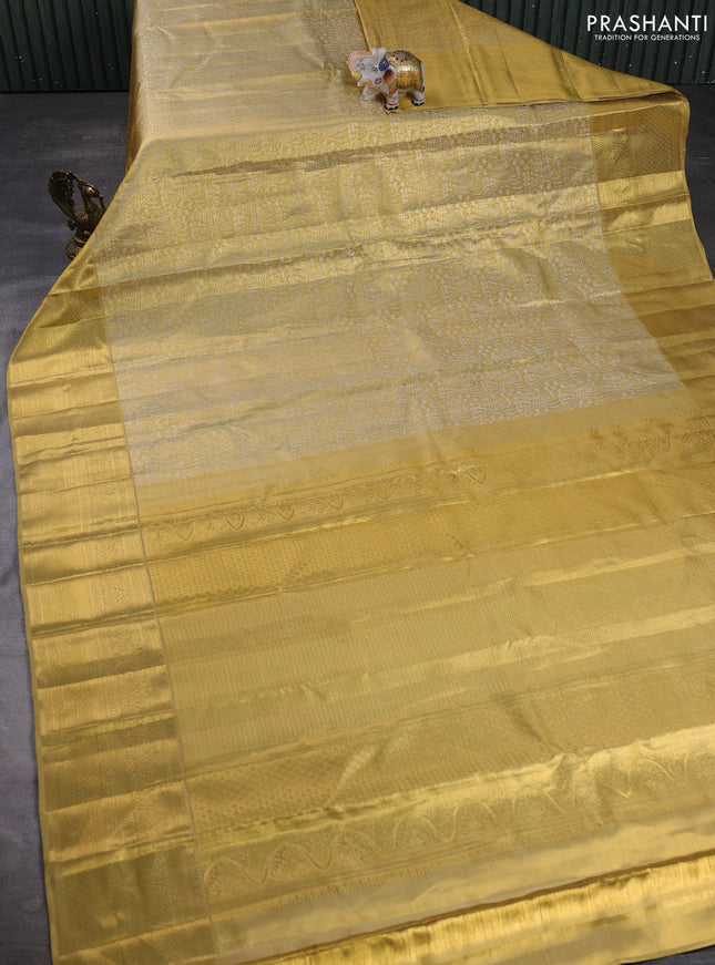 Pure kanchipuram tissue silk saree gold with allover zari woven brocade weaves and long rich zari woven border