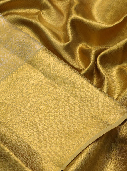 Pure kanchipuram tissue silk saree gold with allover zari woven brocade weaves and long rich zari woven border