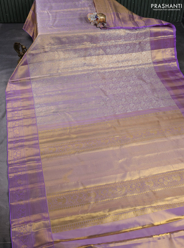 Pure kanchipuram tissue silk saree pastel lavender with allover zari woven brocade weaves and long rich zari woven border