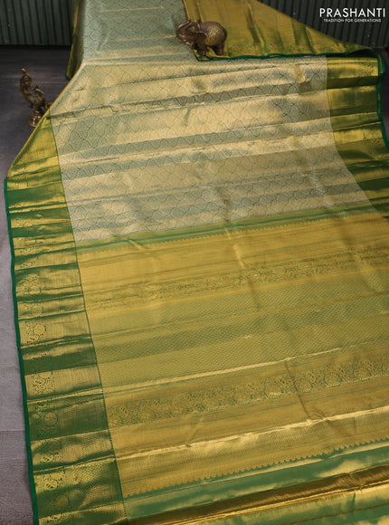 Pure kanchipuram tissue silk saree golden green and green with allover silver zari woven brocade weaves and rich zari woven border