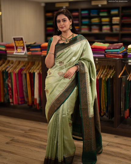 Banarasi raw silk saree pista green and green with allover thread & zari woven buttas and thread & zari woven border