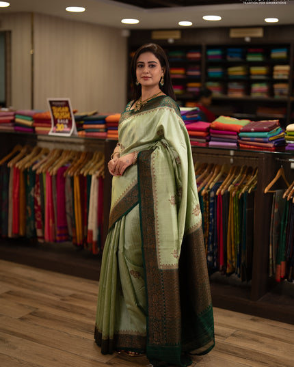 Banarasi raw silk saree pista green and green with allover thread & zari woven buttas and thread & zari woven border