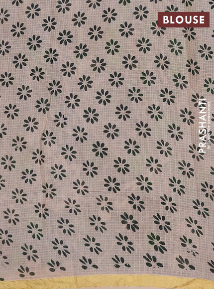 Kota kalamkari cotton saree beige and bottle green with allover prints and piping border