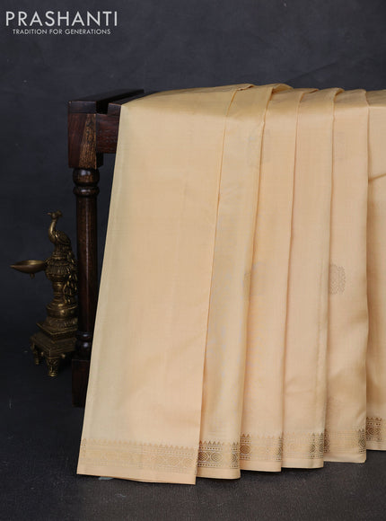 Pure kanchipuram silk saree cream with zari woven buttas and small zari woven border