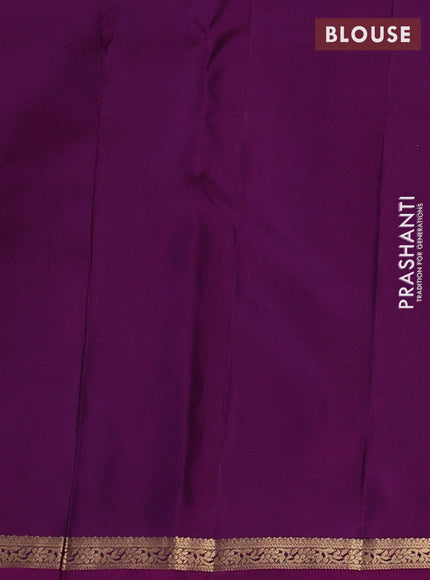 Pure kanchipuram silk saree dual shade of greenish purple and purple with allover zari woven buttas and small zari woven border