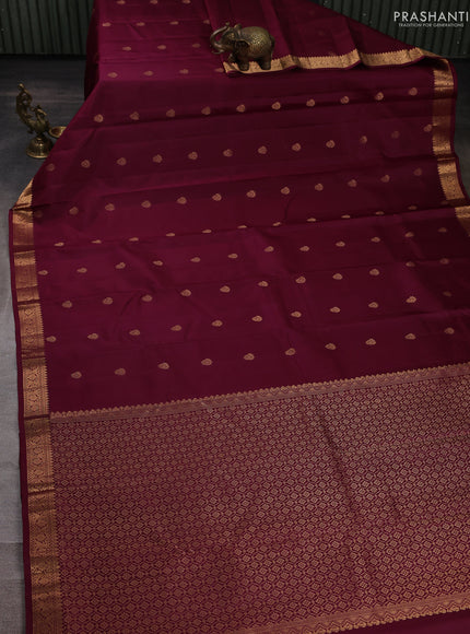 Pure kanchipuram silk saree wine shade with allover zari woven buttas and small zari woven border