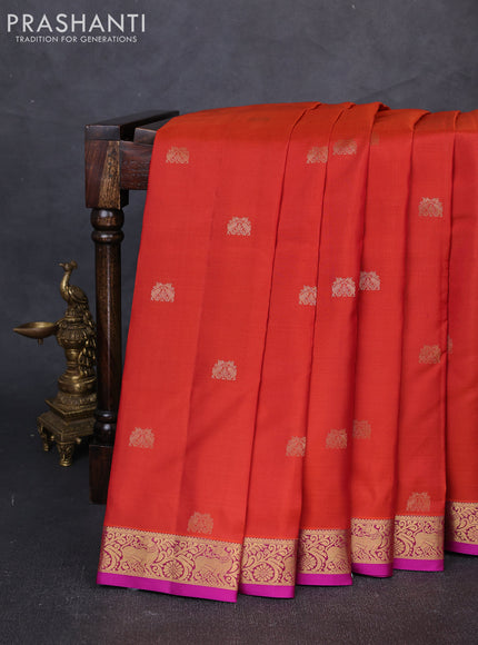 Pure kanchipuram silk saree rust shade and purple with allover zari woven buttas and small zari woven border
