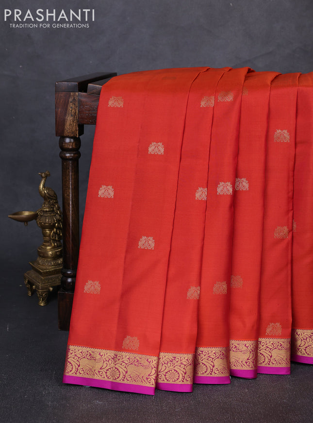 Pure kanchipuram silk saree rust shade and purple with allover zari woven buttas and small zari woven border