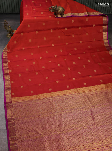 Pure kanchipuram silk saree rust shade and purple with allover zari woven buttas and small zari woven border