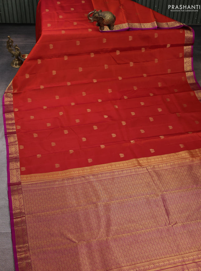 Pure kanchipuram silk saree rust shade and purple with allover zari woven buttas and small zari woven border