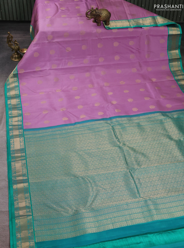 Pure kanchipuram silk saree lavender and teal green with allover zari woven buttas and zari woven korvai border