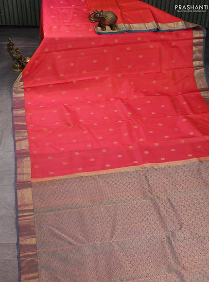 Pure kanchipuram silk saree orange and teal green with allover zari woven buttas and zari woven korvai border