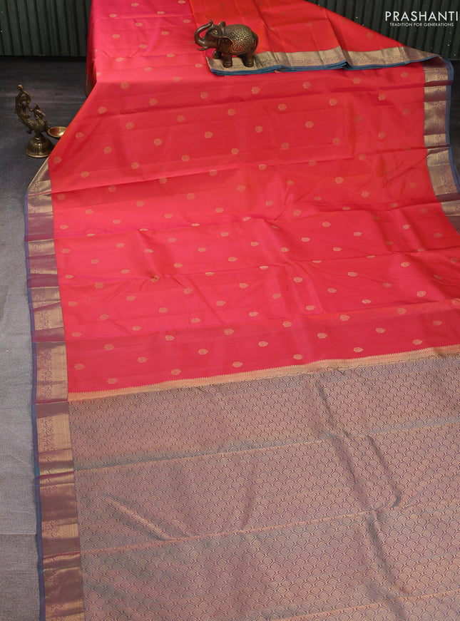 Pure kanchipuram silk saree orange and teal green with allover zari woven buttas and zari woven korvai border