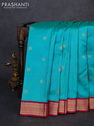 Pure kanchipuram silk saree teal green and wine shade with allover zari woven buttas and zari woven korvai border