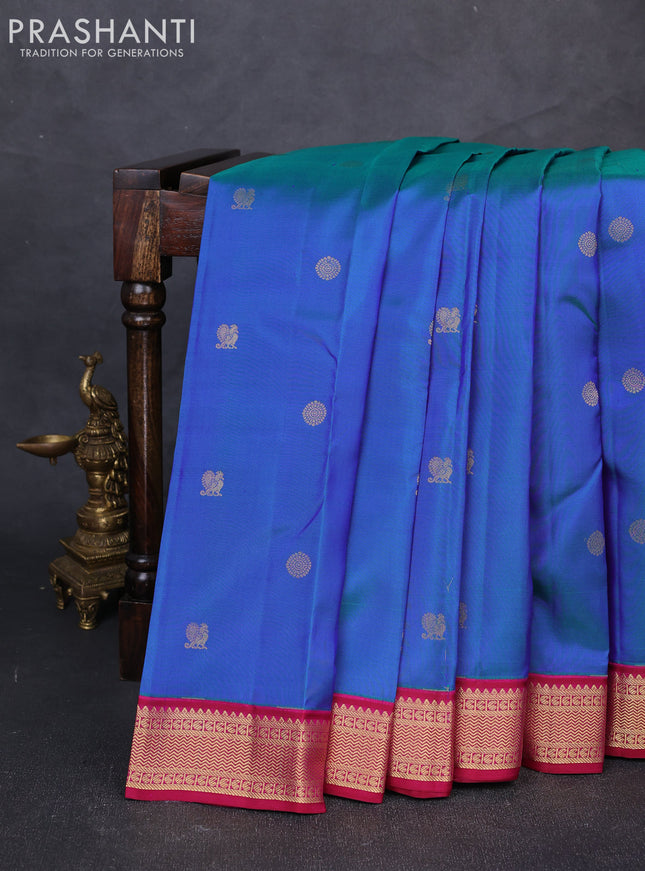 Pure kanchipuram silk saree dual shade of greenish blue and maroon with allover zari woven buttas and zari woven korvai border