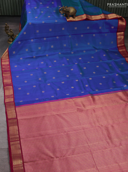 Pure kanchipuram silk saree dual shade of greenish blue and maroon with allover zari woven buttas and zari woven korvai border
