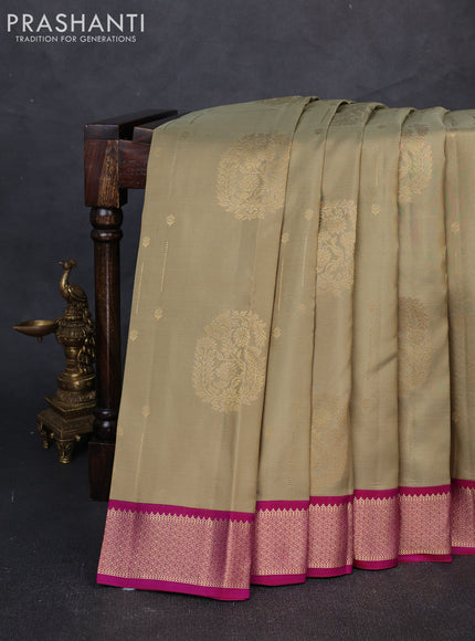 Pure kanchipuram silk saree elaichi green and pink with allover zari woven buttas and zari woven korvai border