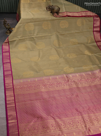 Pure kanchipuram silk saree elaichi green and pink with allover zari woven buttas and zari woven korvai border