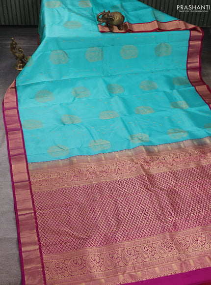 Pure kanchipuram silk saree teal blue and pink with allover zari woven buttas and zari woven korvai border