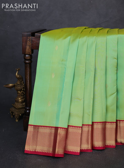 Pure kanchipuram silk saree dual shade of teal green and maroon with allover zari woven buttas and zari woven korvai border