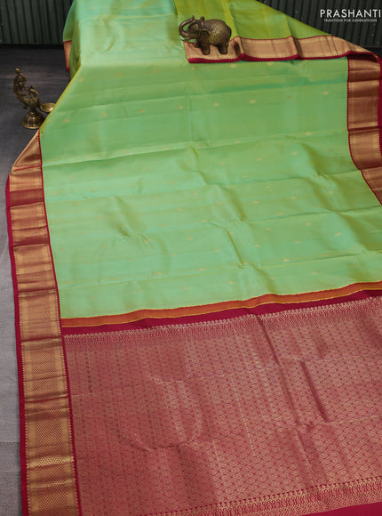 Pure kanchipuram silk saree dual shade of teal green and maroon with allover zari woven buttas and zari woven korvai border