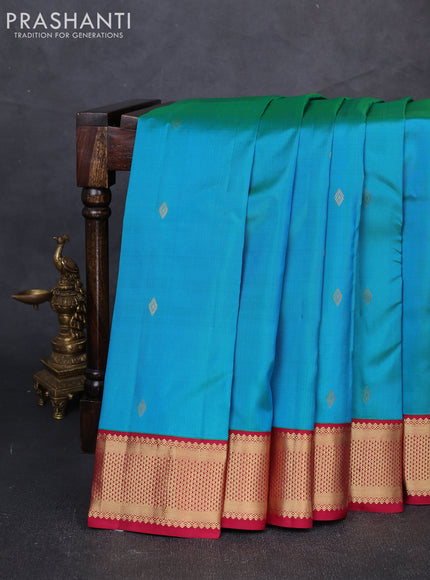 Pure kanchipuram silk saree teal blue and maroon with allover zari woven buttas and zari woven korvai border