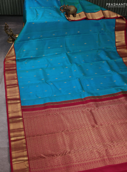 Pure kanchipuram silk saree teal blue and maroon with allover zari woven buttas and zari woven korvai border