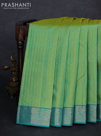 Pure kanchipuram silk saree dual shade of greenish yellow and teal blue with allover zari woven 1000 buttas and zari woven border