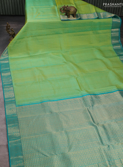 Pure kanchipuram silk saree dual shade of greenish yellow and teal blue with allover zari woven 1000 buttas and zari woven border