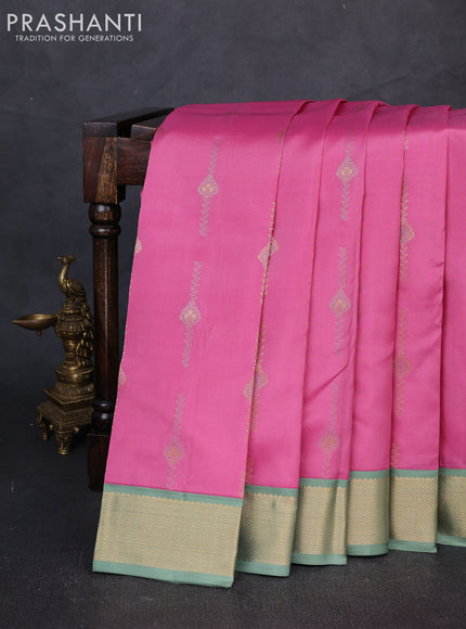 Pure kanchipuram silk saree peach pink and pastel green with allover silver& zari woven buttas and zari woven korvai border